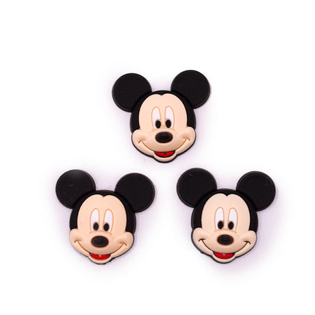 Three Mickey Mouse head-shaped accessories arranged on a plain white background.