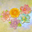 resin flower flat back flowers on a green background