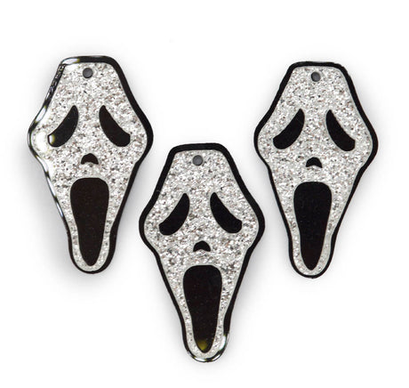 Scream face acrylic charm halloween embellishments on a white background