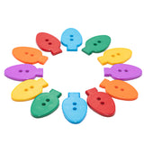 Colorful christmas light sewing buttons on white background