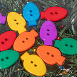 Colorful two hole plastic sewing buttons in the shape of classic christmas lights