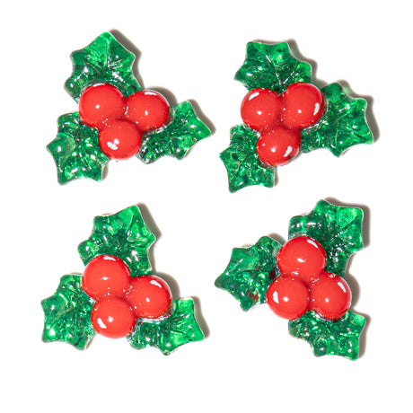 Four festive holly berry decorations on a white background
