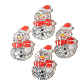 Set of four snowman-shaped glitter resin craft embellishments with red scarves and hats on a white background