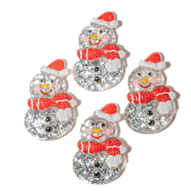 Set of four snowman-shaped glitter resin craft embellishments with red scarves and hats on a white background