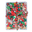 Assorted Christmas-themed decorative items in a clear container with a red ribbon.