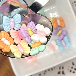 Pretty pastel butterfly embellishments add to children's room decor and spring crafts