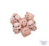 Six adorable pink pigs add to barnyard and animal themed projects