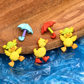 Adorable yellow ducks and umbrellas add to rainy day themed and spring crafts