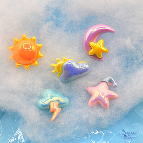 Shiny colorful sky themed embellishments including sun, clouds, moon and star