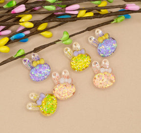 pink, yellow, and purple glitter bunnies for easter and spring crafting