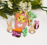 An assortment of Easter-themed buttons and charms for crafting 