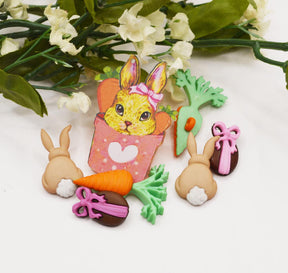 An assortment of Easter-themed buttons and charms for crafting 