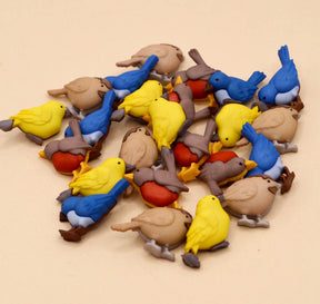 A 24 piece button assortment of birds for crafting spring and nature projects