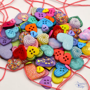 assortment of of heart shaped buttons and embellishments for crafting