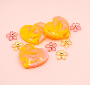 Orange and pink flat-back hearts and rhinestone flowers. 