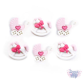Rocking horses and baby carriages in pink and white 