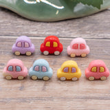 pastel car craft embellishments on wood background