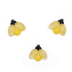 A pack of large resin bees in a mild yellow color for diy crafts