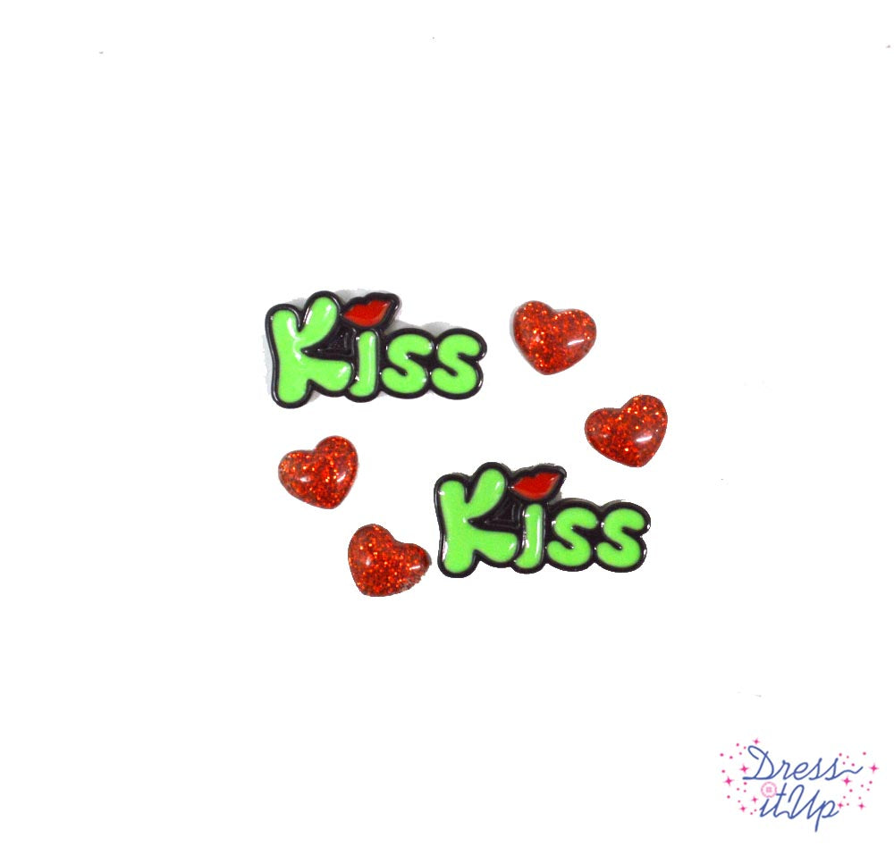 Two green kisses and four resin glitter heart embellishments