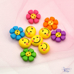 Yellow smiley faces and bright flowers for crafting