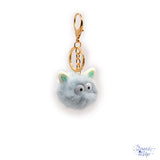 Fluffy little critter in blue adds to bag and keychain projects