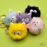 Fluffy little critters add to bag and keychain projects, choose blue, black, purple, yellow or pink