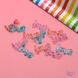 glitter transparent resin in the shape of the word, love for paper and wood crafting