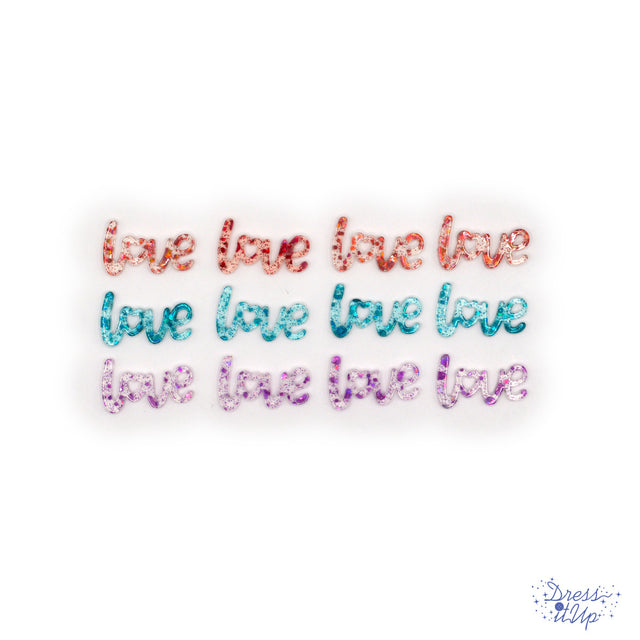 glitter transparent resin in the shape of the word, love for paper and wood crafting