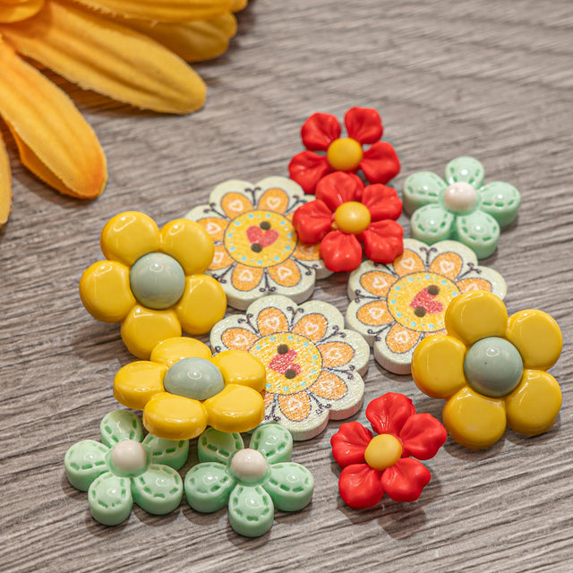 Colorful flower-shaped buttons on a wooden surface