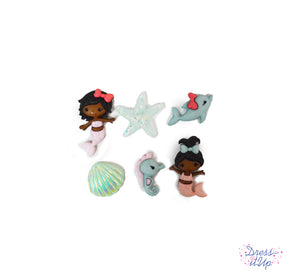 Tiny mermaids, a dolphin, a seahorse, starfish and shell are perfect for ocean themed crafts and children's projects
