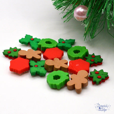 assortment of Christmas themed craft buttons in wreath, gingerbread, and snowflakes. 