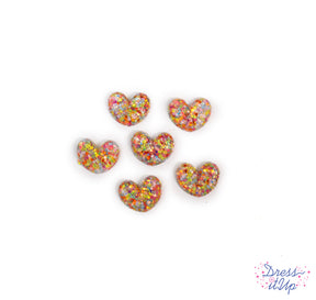 Contains six flat-back rainbow confetti resin hearts
