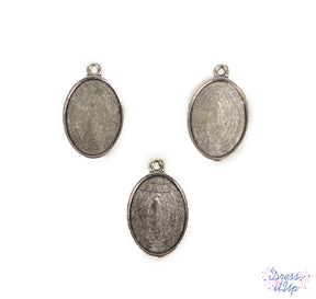 Embellish sturdy pendant bases with buttons and beads to create jewelry and charms