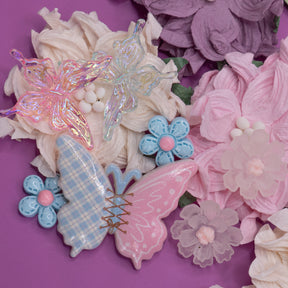 Light pink and blue butterfly and flower craft embellishments make perfect decorations for wood, paper, and fabric crafts