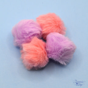 Add pink and purple pom poms to bag charms and keychains