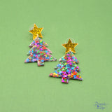Made from lightweight resin, each earring showcases a glittering confetti Christmas tree topped with a sparkling star