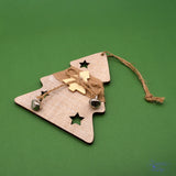 Add a touch of rustic charm to your holiday décor with this delightful Wood Tree Ornament featuring a jingle bell accent