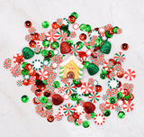 Colorful Christmas-themed clay faux candy pieces on a white background