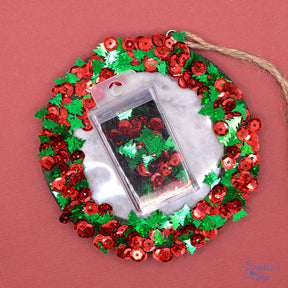 Shiny red sequins and glittering green trees add to holiday and winter themed crafting