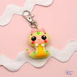 An adorable snake design is perfect to add to jewelry and keychains