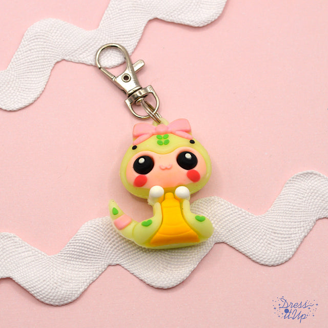 An adorable snake design is perfect to add to jewelry and keychains