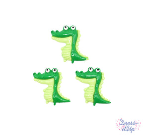 three large crocodile themed craft embellishments