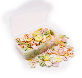 Assortment of sewing buttons in pastel southwest tones in various sizes and styles. 