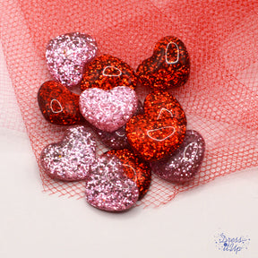 Glitter flat-back resin hearts in red and pink 