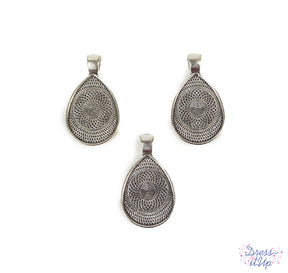 Embellish sturdy teardrop pendant bases with buttons and beads to create jewelry and charms