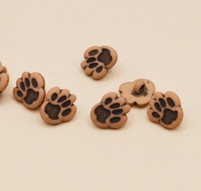 tiny brown and black dog paw shank back buttons for sewing and craft projects