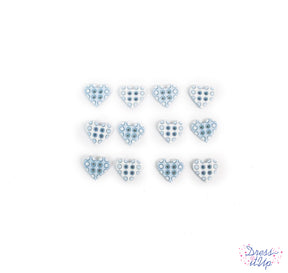 Tiny 4-hole heart shaped buttons in blue add to nursery and baby crafting