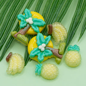banana, pineapple, and palm tree resin flat-back embellishments for crafting. 