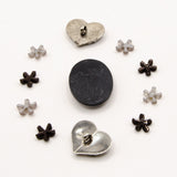 black, white, and silver metal vintage floral themed embellishment pack for crafting.