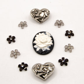 black, white, and silver metal vintage floral themed embellishment pack for crafting.